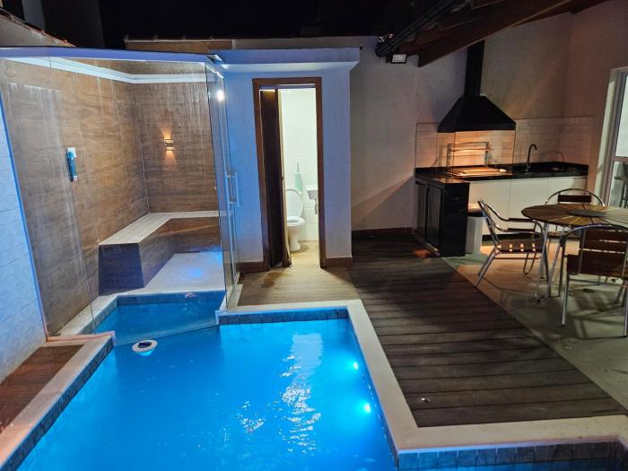 Casa em Boiçucanga com 2 suítes, piscina e sauna integrada