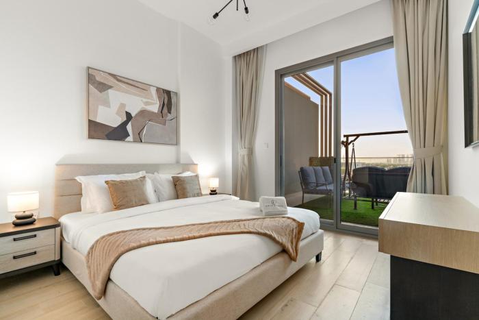 Bright 2BR Retreat Balcony & Pool Near Jumeirah Village Circle
