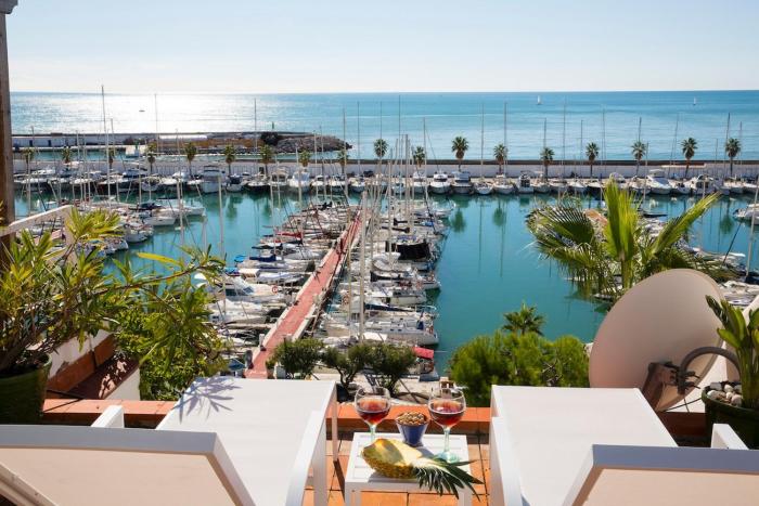 Stunning sea views over marina with swimming pool
