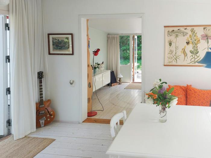 Cottage In Woodland Garden In Natural Harmony