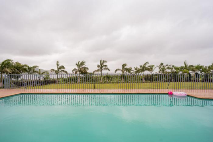 StayVistas Eva Villa - Lakeside Luxury with Modern Decor, Pool & Expansive Lawn - Near Sula