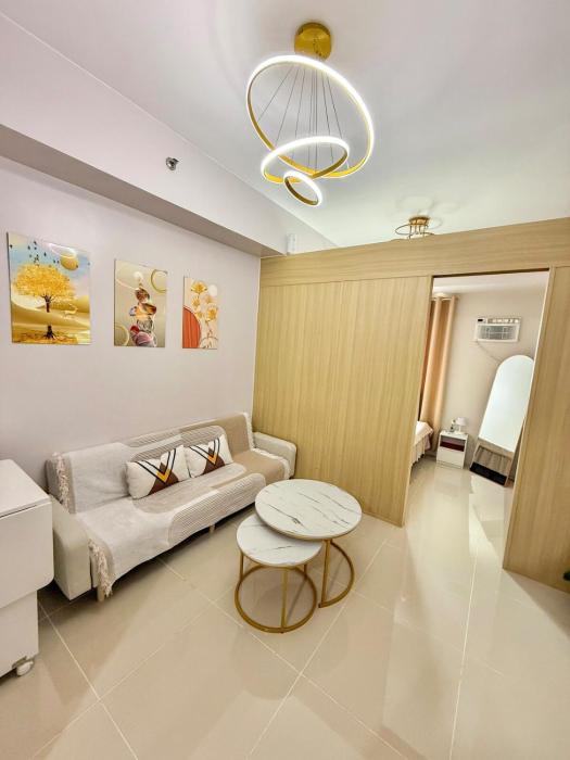 Cozy 1BR Condo at Grass Residences near SM North