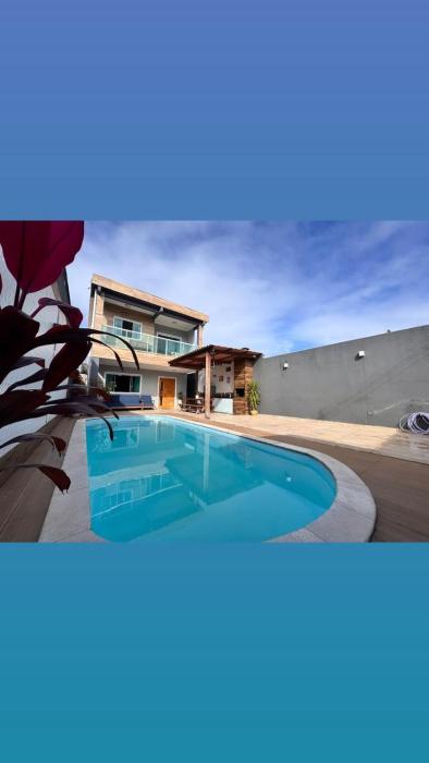 Casa com telão e Área gourmet 550 metros da praia