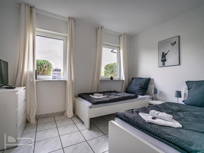 Voll ausgestattetes und möbliertes Apartment mit Einzelbetten - Küche - WLAN - Terrasse