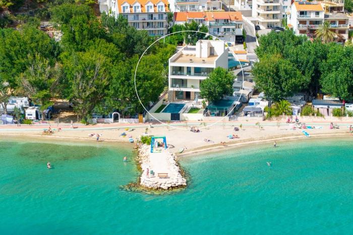 Beachfront Villa Erce with private 40sqm heated pool, a Gym, 7 en-suite bedrooms, a rooftop terrace, 2 living areas