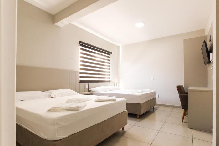 Lou Suítes - Suíte 03 com 2 camas de casal - Conforto para sua Família