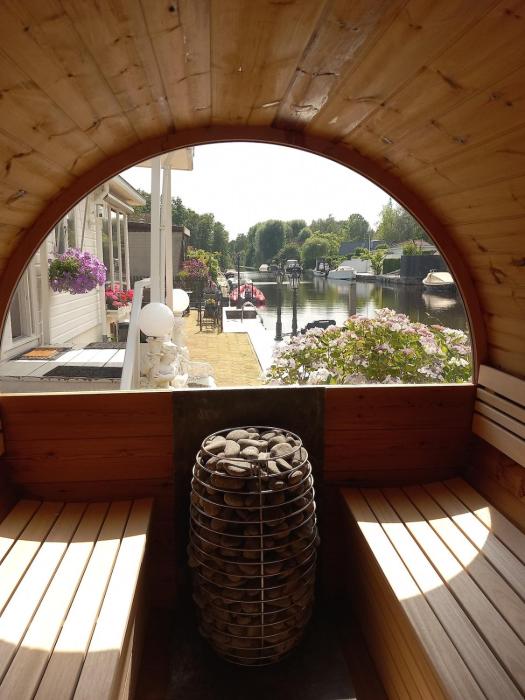Chalet with waterfront sauna and boat