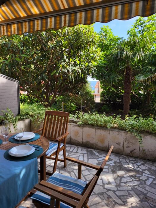 House near sea coast with green surrounding