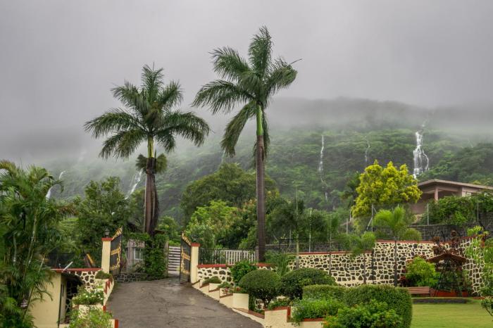 SaffronStays Silver Falls - 3BR colonial-style villa with pool, lawns, wooden bridge & monsoon waterfall views