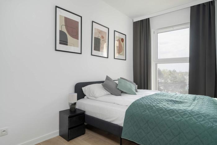 Tasteful Apartment with Parking and Gym by Noclegi Renters