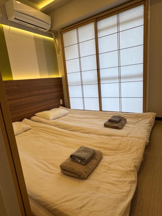 Minshuku 203 under the clear sky 8-minute walk from Kinshicho Station direct line to Narita Airport 50-minute walk from Disneyland and 1-minute walk from the mall