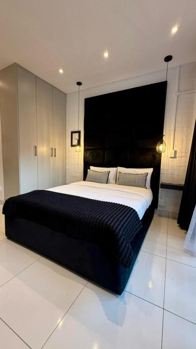 The Monochrome Apartment 209 - Urban Chic Escape - Open Plan Bathroom with Bathtub