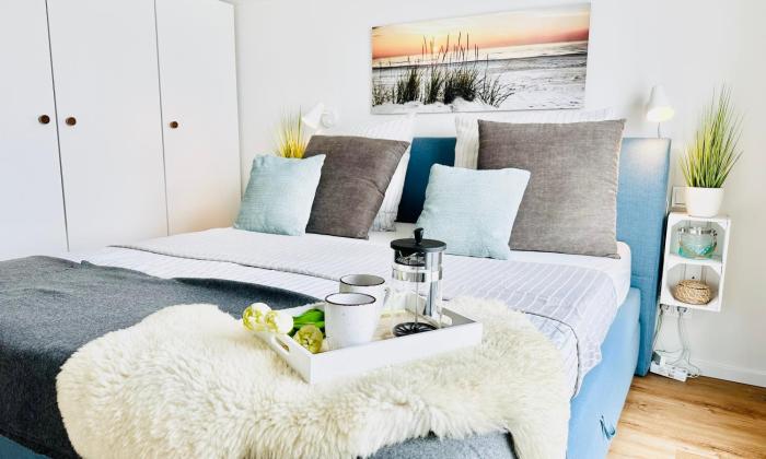 Surfbude, Olpenitz - moderne Ferienwohnung in direkter Strandnähe mit eigenem Eingang, Sauna, Kaminofen, Balkonterrasse und Parkplatz