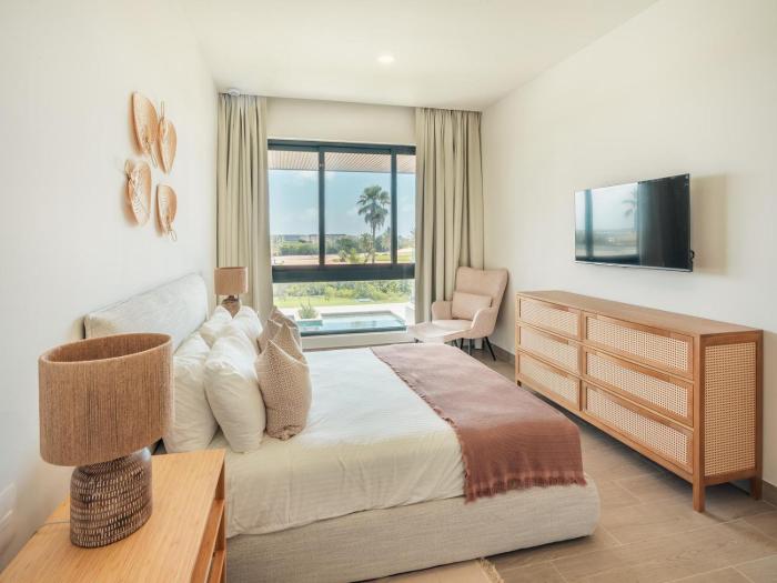 Apartment with balcony and pool view in Cap Cana