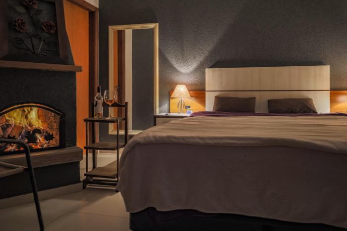 Chalé para casal com lareira, cozinha e jardim