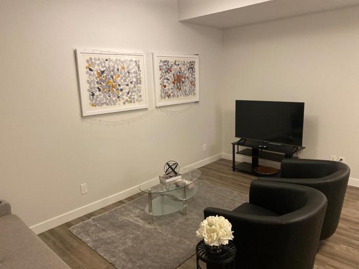 Brand new suite with parking pad at the back