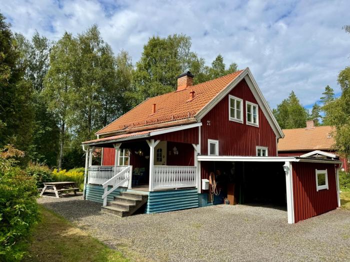 House near forest and water