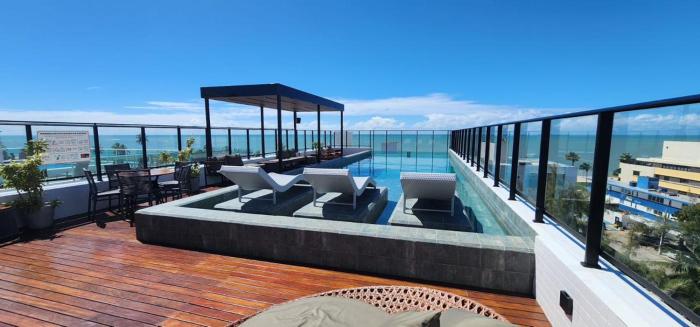 Flat a 50 metros da praia + piscina e área gourmet