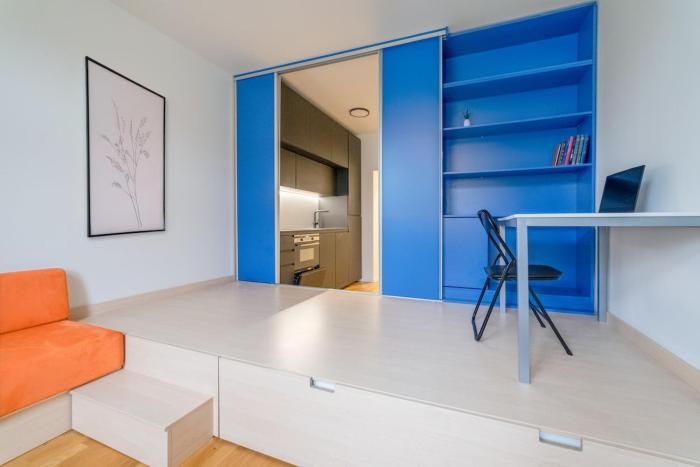 Chic Navy Studio with Balcony & Church View by Rentez