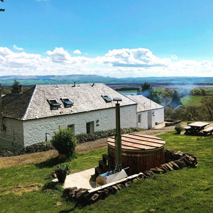 Buzzard Cottage nestled in a hillside farm