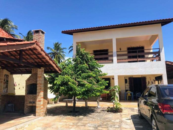 Casa com churrasqueira, varanda e uma brisa especial