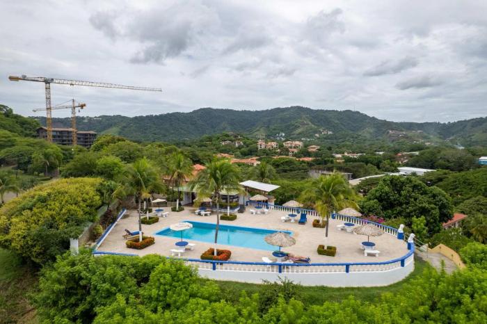 Modern Top-Floor Condo with Panoramic Views and Community Pool