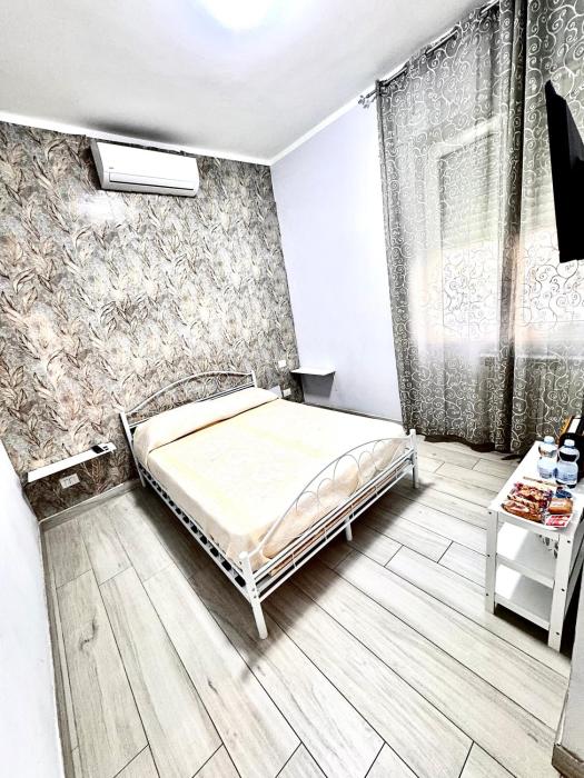 Camera matrimoniale elegante e confortevole con aria condizionata