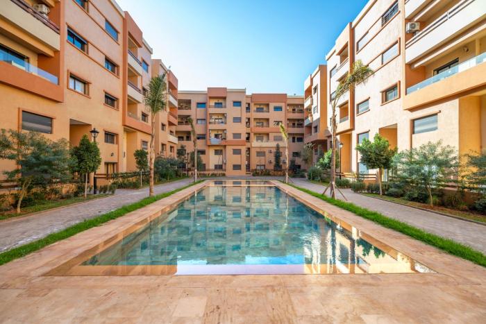 Quiet 2-Bedroom Apartment with Pool & Balcony