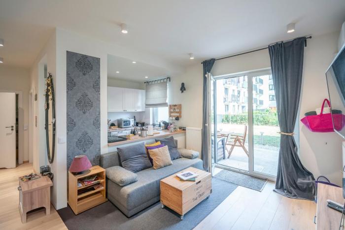 Beautiful apartment with garden and private garage, close to the airport