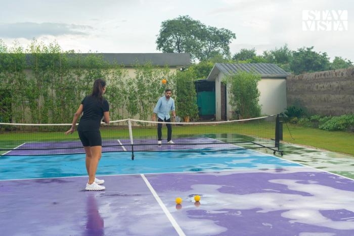 StayVista at Aarna Estate with library, lawn