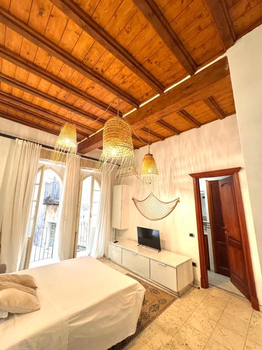Kalma Via Manno - Central Stay with Stone Walls & Private Cinema