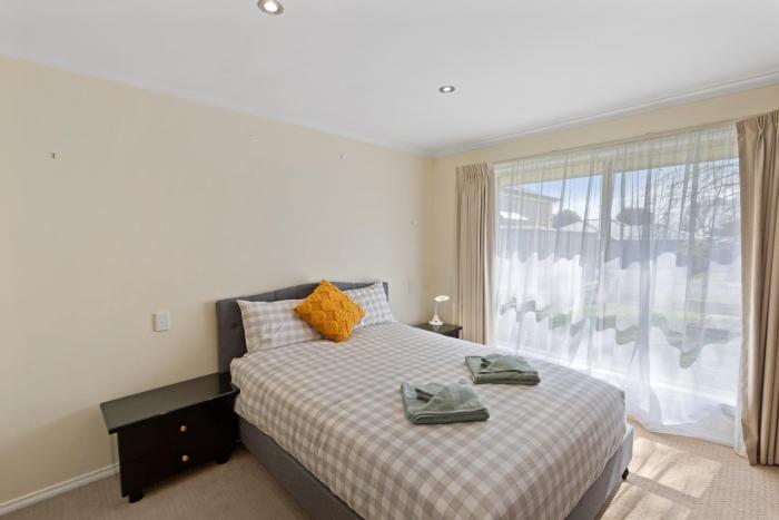 Comfortable 4-Bedroom Home with Backyard Escape