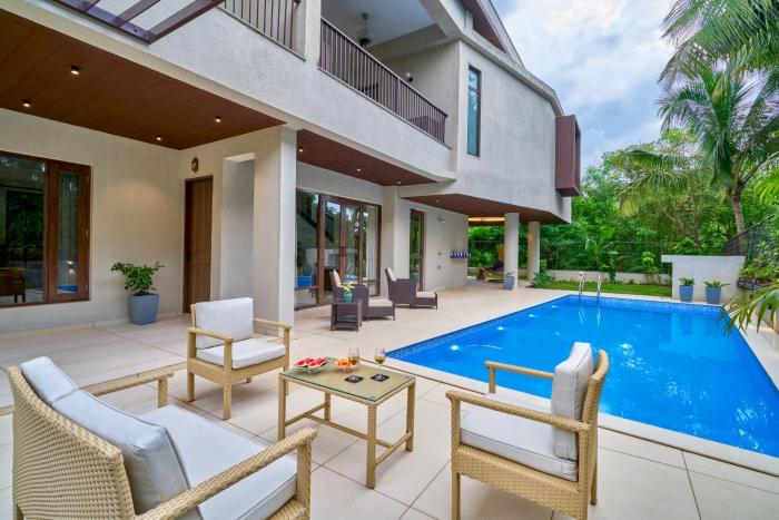 SaffronStays Sea Breeze - 4BR pool villa with games room, terrace & lawns near Saral Beach & Mandwa Jetty, Alibaug