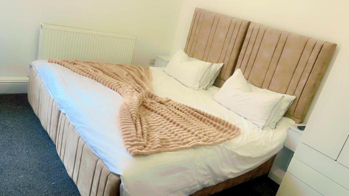 studio apartment with small kitchen and bathroom