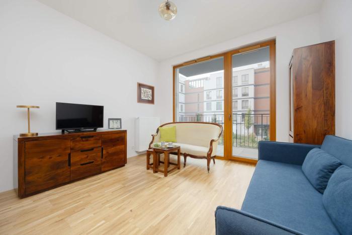 Climatic Apartment with Parking & Balcony Ideal for Business Travelers by Noclegi Renters