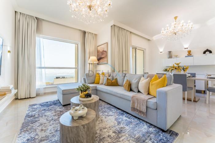 Panoramic Sea and Canal Views from High-Floor 2BR, Steps from Tram and Marina Beach, Shams 2, JBR by Dekuxe Holiday Homes
