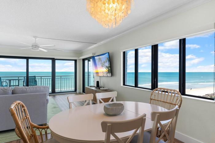 Updated direct oceanfront corner condo with large wrap-around balcony and heated pool