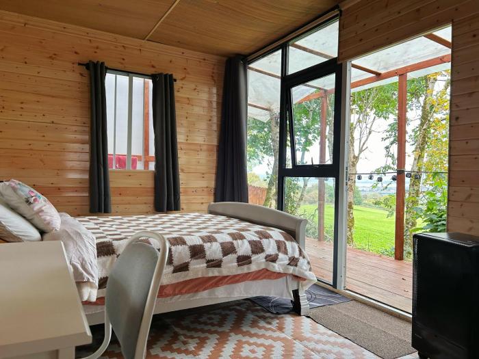 Valley view cabin in the woods on a farm