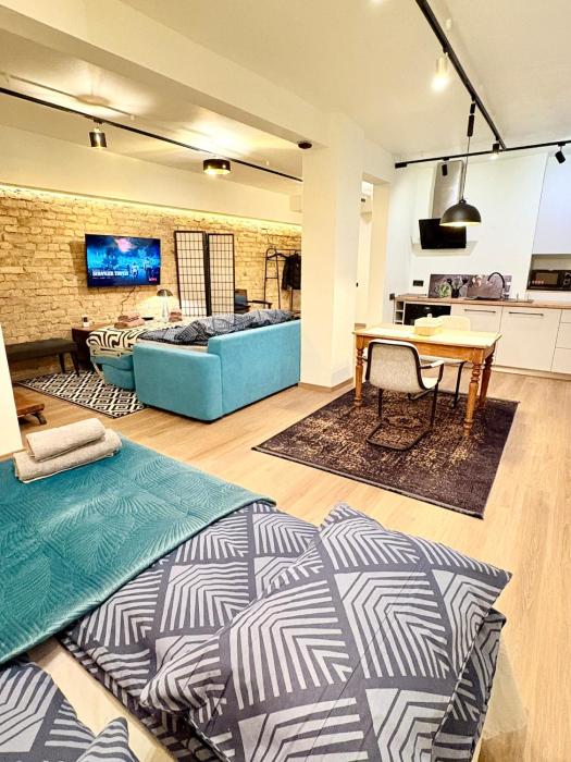 Skaists ķieģeļu studijas dzīvoklis Rīgas centrā