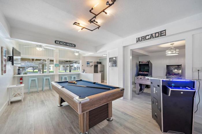 Canal Front Home with Boat Slip, Game Room, and Great Water Views