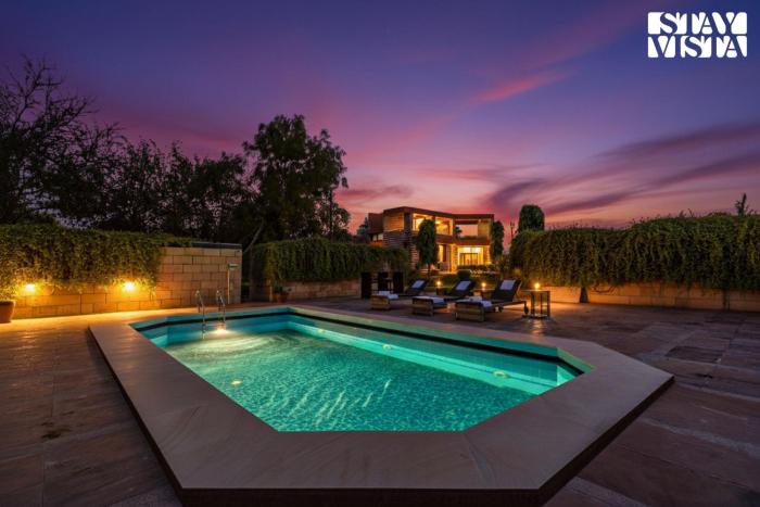 StayVista at The Cityscape With Outdoor Pool