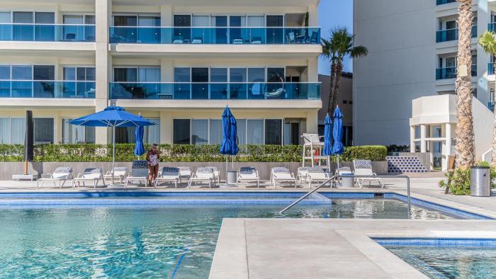 Relax in this modern ocean front condo Encantame E1404
