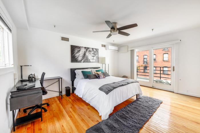 Modern 3BR Townhouse with Private Rooftop & Parking Minutes to NYC