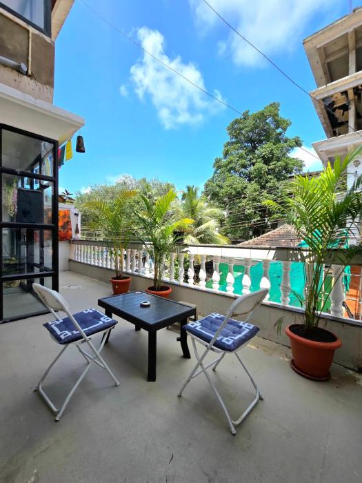 Sundowner Cozy 1 BHK ,5 min Beach ,AC & Balcony