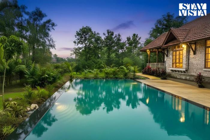 StayVista at Orchard by the River with Bonfire, BBQ