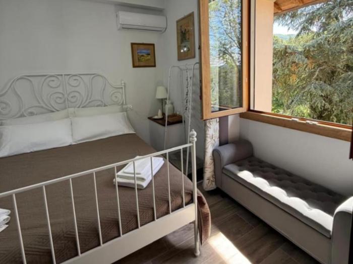 Charming Guest Room in Villa Casavecchia with City, Garden, and Mountain Views