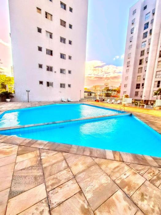 Vá andando para Praia, de frente á mercado com vaga e lazer completo