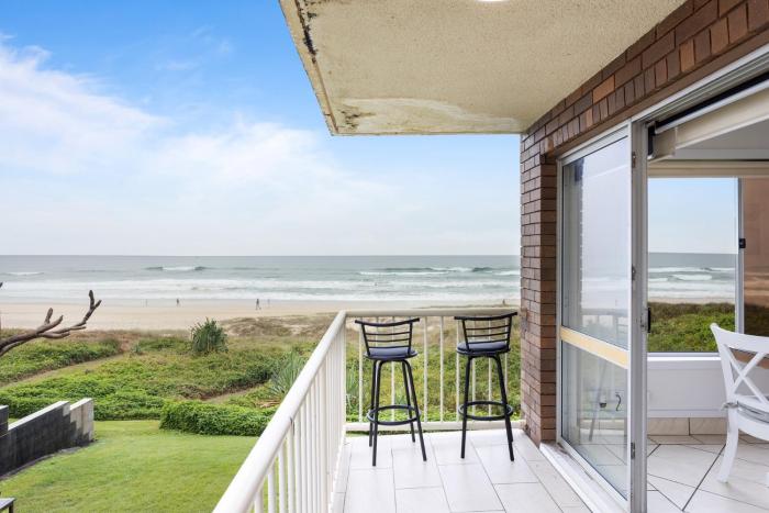 Wake to Waves in Spacious 3-Bed Beachfront Unit