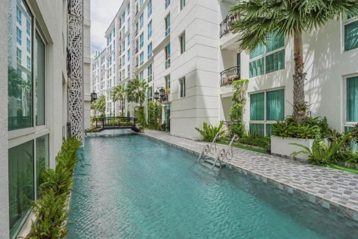 Olympus city garden direct pool access apartment by Sankalp