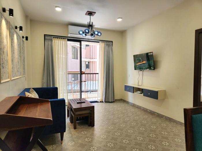 Central Candolim 1BHK Apartment Bright Living, TV & Kitchenette